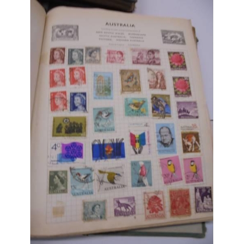 96 - Three Swiftsure albums of world stamps.