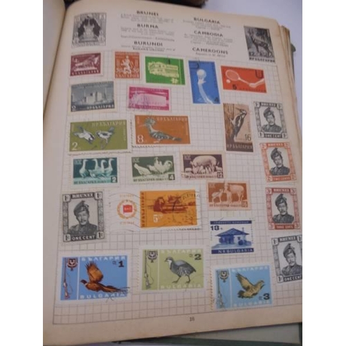 96 - Three Swiftsure albums of world stamps.