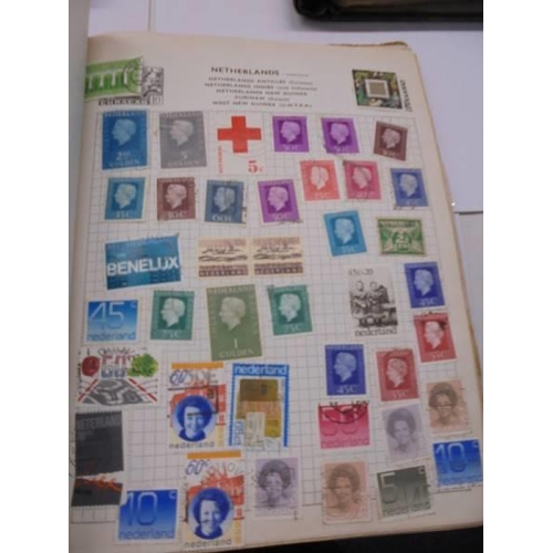 96 - Three Swiftsure albums of world stamps.