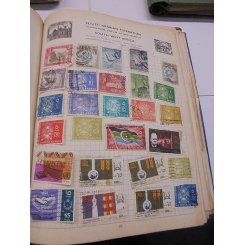 96 - Three Swiftsure albums of world stamps.