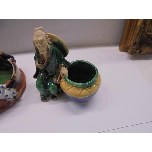 99 - A Japanese hand formed clay bowl with figures and two other figures (one a/f).