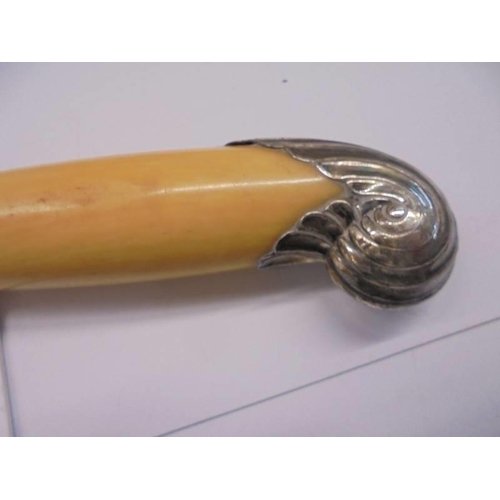 124 - A silver handled cake slice and a carving set with silver mounts (knife a/f).