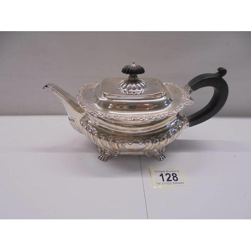 128 - A hall marked silver teapot, total weight 18 ounces.