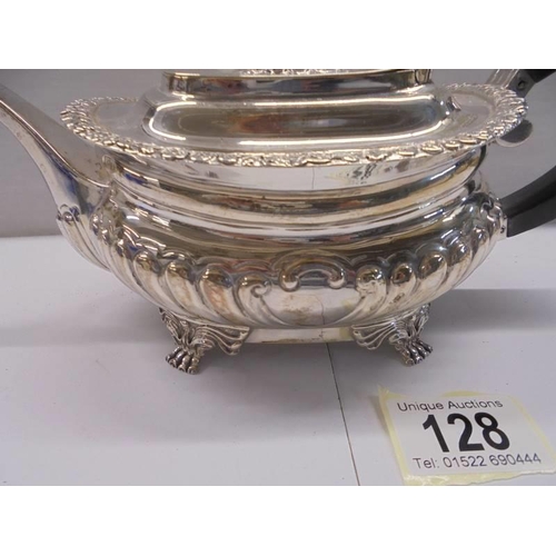 128 - A hall marked silver teapot, total weight 18 ounces.