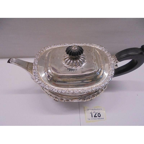 128 - A hall marked silver teapot, total weight 18 ounces.