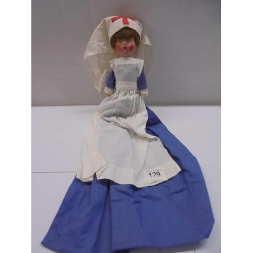 129 - A vintage cloth nurse doll.