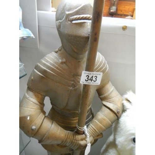 343 - A tall metal Knight in armour door stop. COLLECT ONLY.