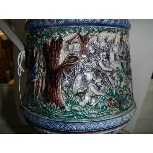 356 - A 20th century ceramic jug featuring battle scenes.