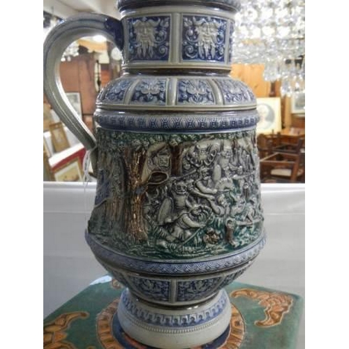 356 - A 20th century ceramic jug featuring battle scenes.