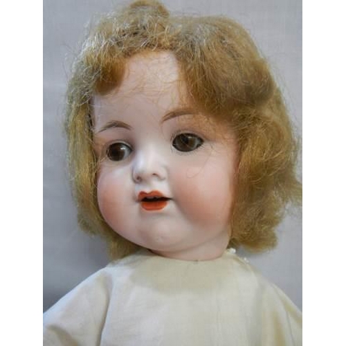 357 - An Armand Marseille porcelain headed doll.