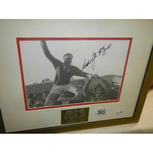 365 - A framed and glazed signed photograph featuring rugby by the Times. COLLECT ONLY.