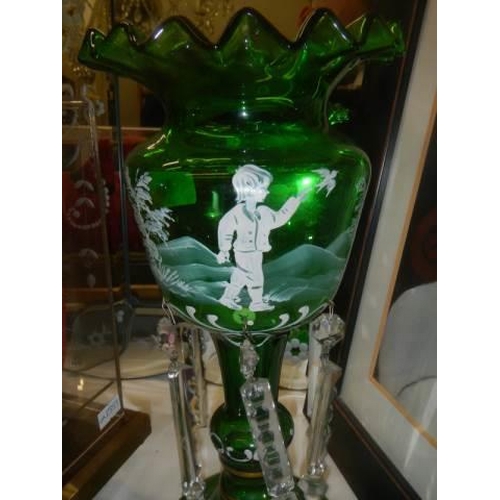 375 - A late Victorian green glass Mary Gregory lustre (some drops a/f)