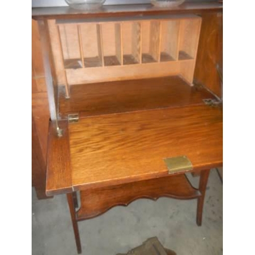 384 - An Arts and Crafts writing desk. COLLECT ONLY.