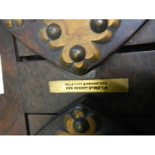 394 - A Victorian adjustable book rack with brass fittings.