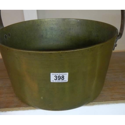 398 - A large brass jam pan.