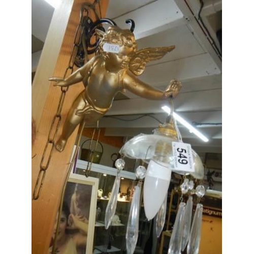 549 - An Edwardian gilt cherub wall light with glass droppers and bracket, COLLECT ONLY.