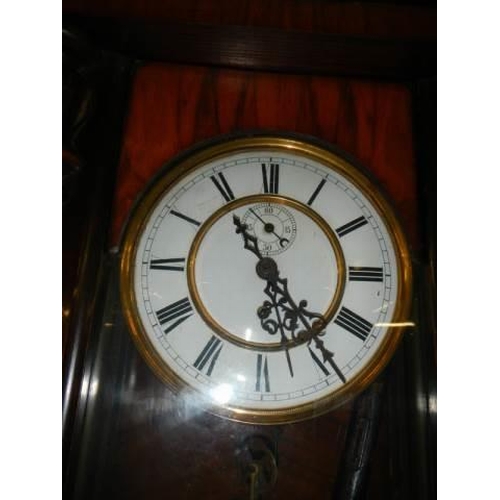 556 - A mahogany single weight Vienna wall clock, COLLECT ONLY.