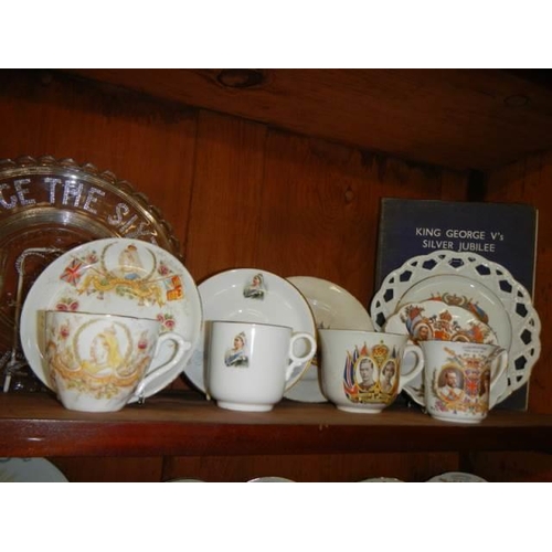 562 - A mixed lot of commemorative ware on two shelves. COLLECT ONLY.