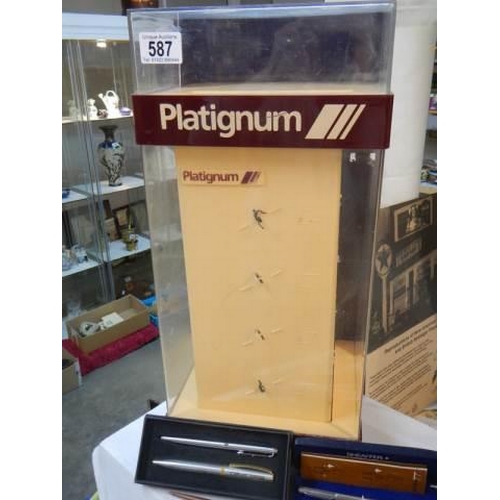 587 - A mid 20th century Platignum fountain pen display stand and old pens, COLLECT ONLY.