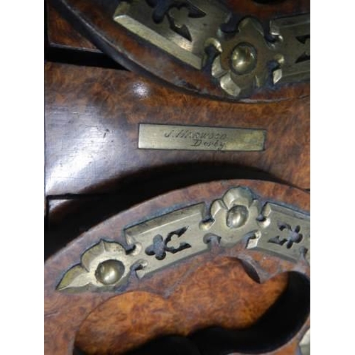 592 - A late Victorian figured walnut adjustable book stand with brass fittings.