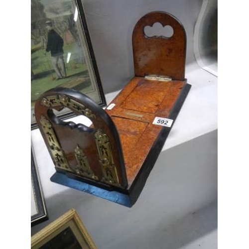 592 - A late Victorian figured walnut adjustable book stand with brass fittings.