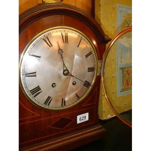 629 - A Victorian mahogany cased bracket clock with silvered dial, in working order, COLLECT ONLY.