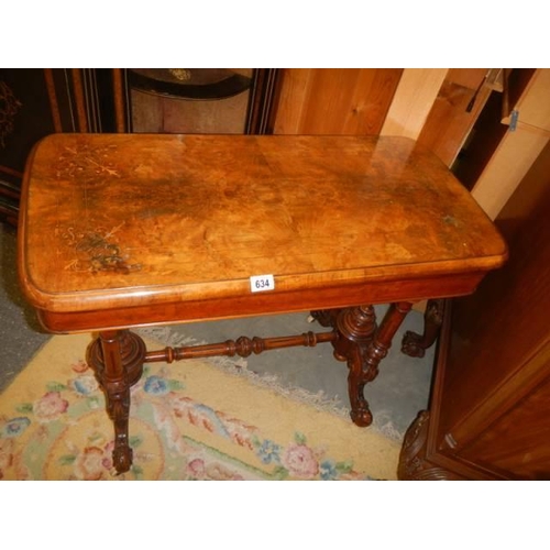 634 - A mid Victorian mahogany fold over games table, COLLECT ONLY.