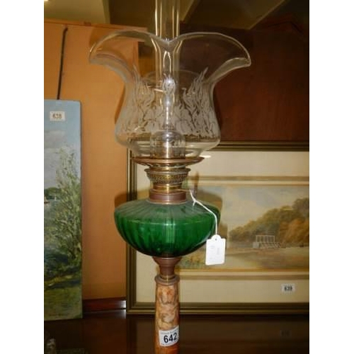 642 - A Victorian oil lamp on brass base with polished stone column and glass font, COLLECT ONLY.