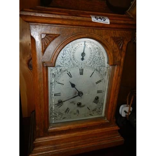 645 - An oak cased mantel clock with silvered dial, COLLECT ONLY.