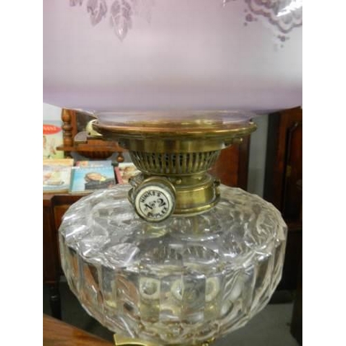 648 - A brass Corinthian column oil lamp with original shade. COLLECT ONLY.