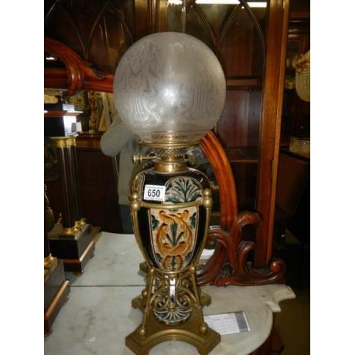 650 - A good drop in font Doulton style oil lamp with Hinks burner and original shade. COLLECT ONLY.