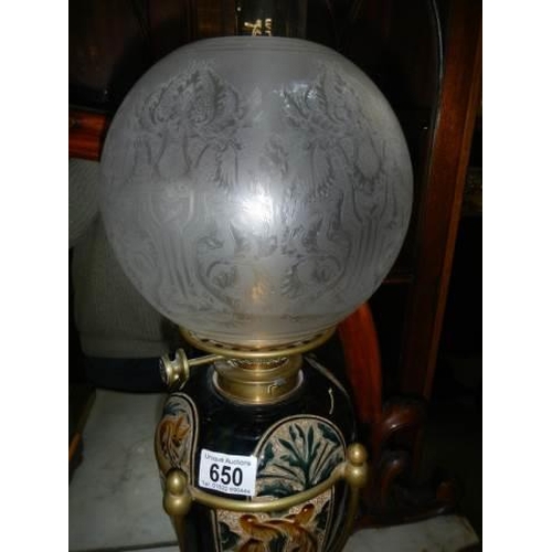 650 - A good drop in font Doulton style oil lamp with Hinks burner and original shade. COLLECT ONLY.