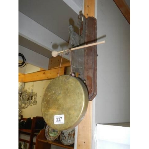 337 - An early 20th century wall hanging brass dinner gong.