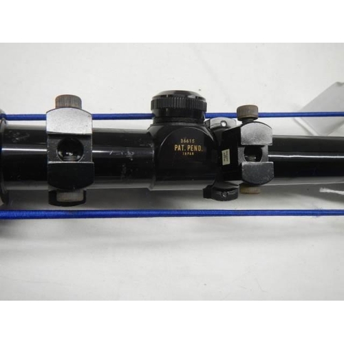 611 - A Rhino electropoint Hakko mark VIII 4x - 12 x 40 rifle scope.