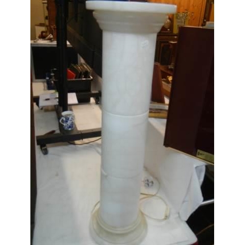 620 - A tall alabaster illuminated torchere. COLLECT ONLY.