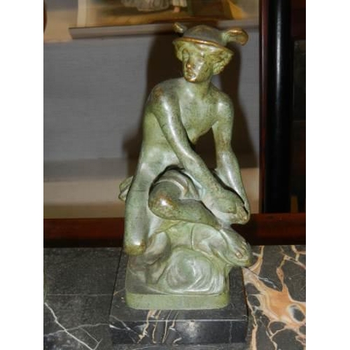 659 - A Victorian bronze inkwell featuring a figure on a slate base. COLLECT ONLY.