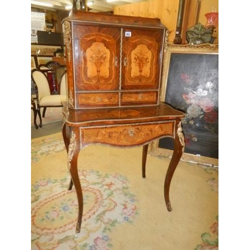 662 - A French marquetry inlaid ladies writing desk with pull out slope. COLLECT ONLY.