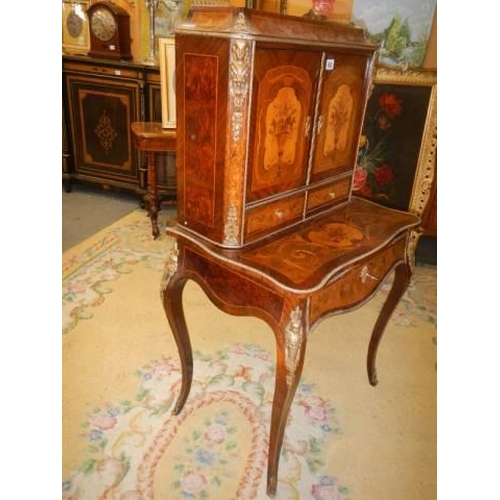 662 - A French marquetry inlaid ladies writing desk with pull out slope. COLLECT ONLY.