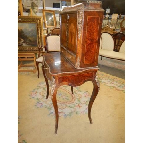 662 - A French marquetry inlaid ladies writing desk with pull out slope. COLLECT ONLY.