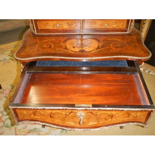 662 - A French marquetry inlaid ladies writing desk with pull out slope. COLLECT ONLY.