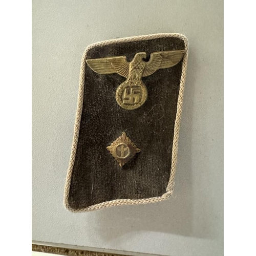 114 - German badges and bands including Iron Cross 2nd class, SS armband, SS skull pin etc.,