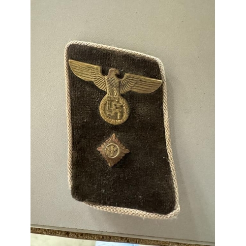 114 - German badges and bands including Iron Cross 2nd class, SS armband, SS skull pin etc.,