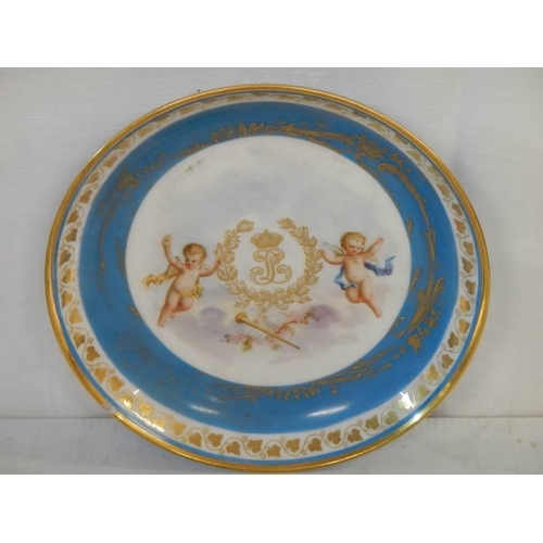 135 - A French porcelain monogrammmed plate a/f (chip to rim) and a smaller plaque.