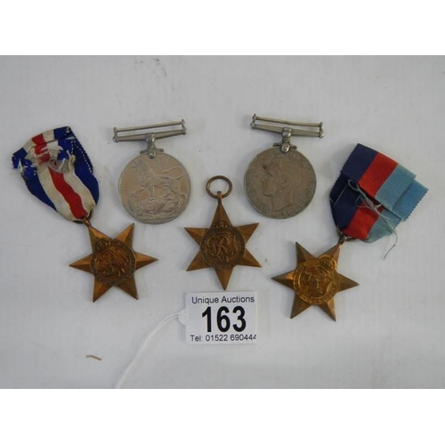 163 - Five medals, The France & Germany Star, 2 x 1939-45 stars and two other medals.