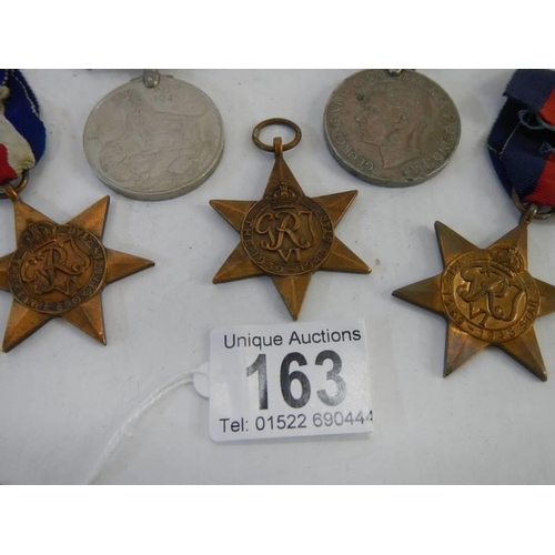 163 - Five medals, The France & Germany Star, 2 x 1939-45 stars and two other medals.