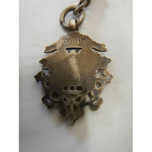 168 - A hall marked silver watch chain with silver fob.