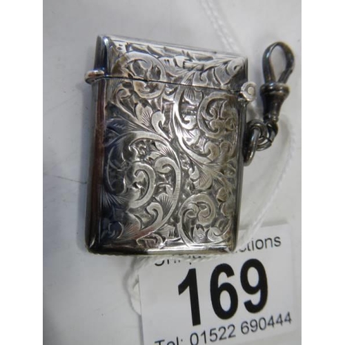 169 - A hall marked silver vesta case with gold (375) mounts, in good condition.