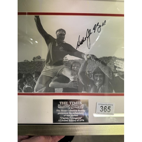 365 - A framed and glazed signed photograph featuring rugby by the Times. COLLECT ONLY.