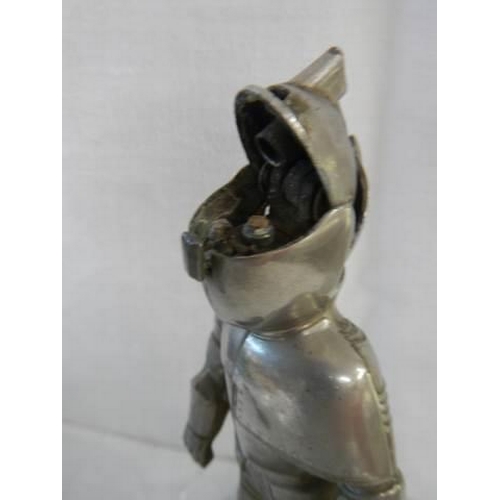 181 - A mid 20th century table lighter in the form of a standing knight.