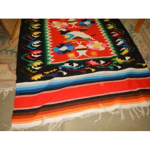 186 - A large woven wall hanging, 100 x 220 cm.